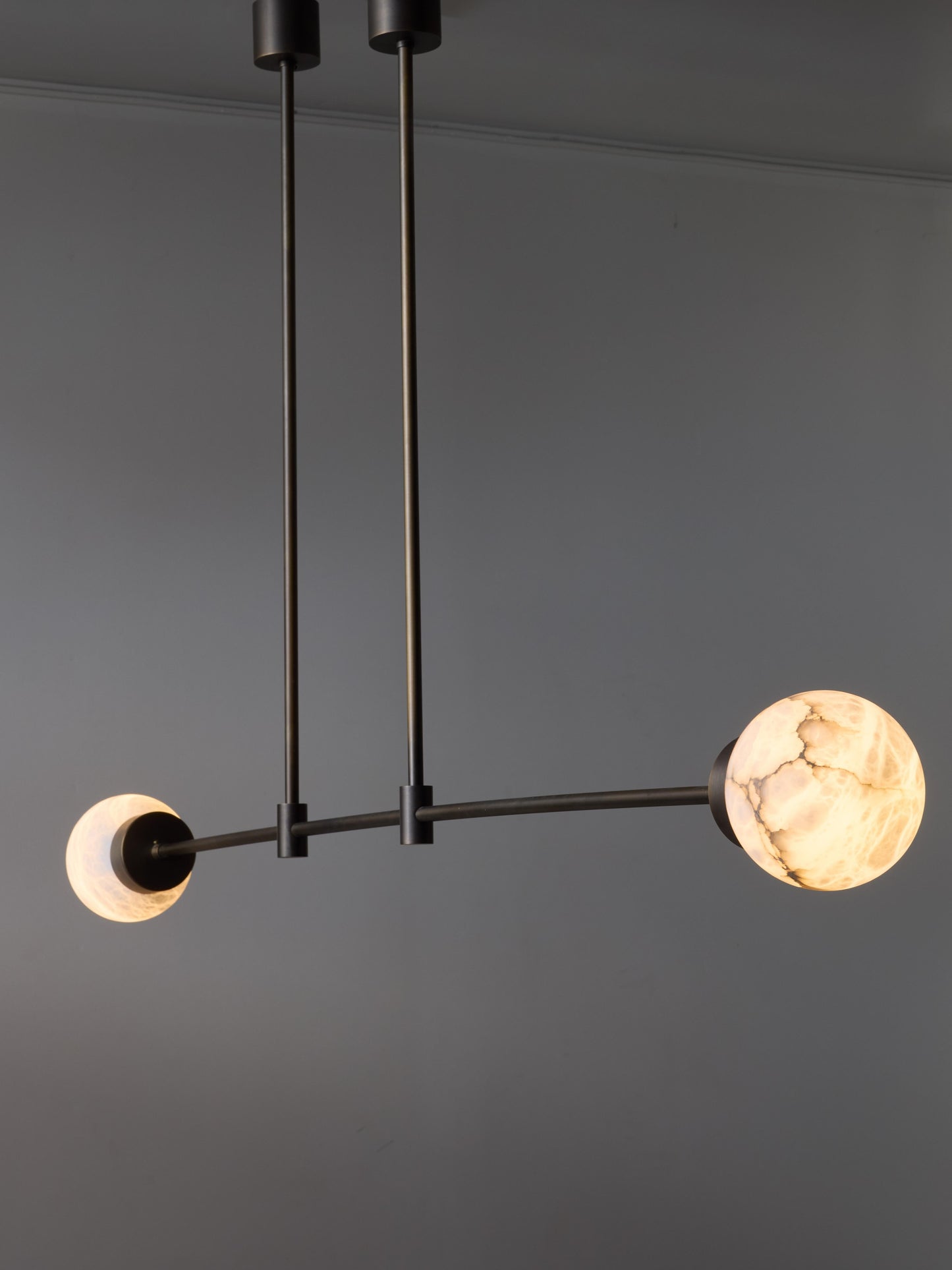 Brass and Alabaster Globes Asymmetrical Line Chandelier